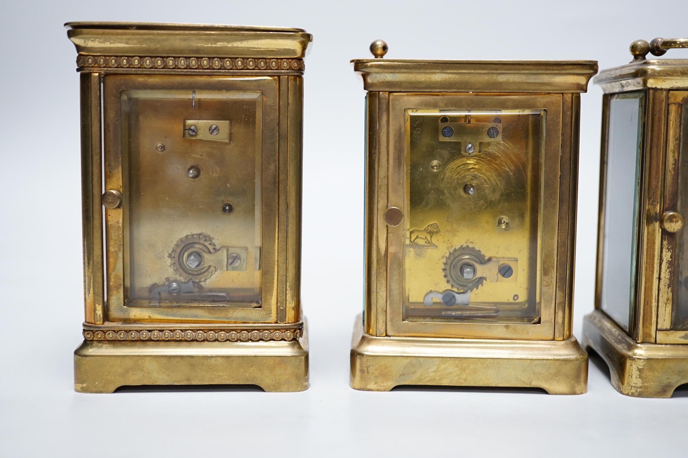 Four carriage clocks in varying sizes, tallest 12cm high